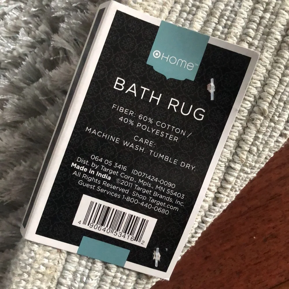 Last chance. Light grey/silver bath rug 1 of 2